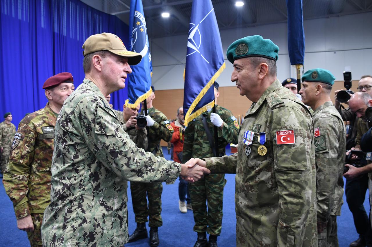 Turkish Major General Ozkan Ulutas (R) shakes hand with Italian Major General Enrico Barduani during ceremony of the Kosovo Peacekeeping Force (KFOR) Command, led by Türkiye to Italy, in Pristine, Kosovo on October 11, 2024. (AA Photo)