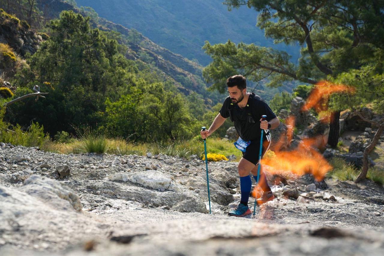 A runner climbs rocky terrain near the eternal flames of Yanartas during the 12th Corendon Tahtali Run to Sky in Kemer, Antalya, May 2026. (Photo via Tahtali Run to Sky Organization)
