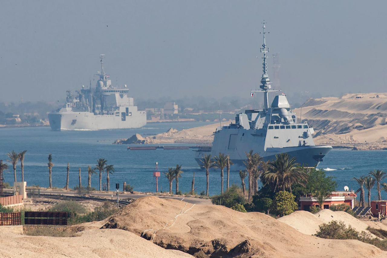 French Navy's carrier strike group, including the flagship aircraft carrier Charles de Gaulle (unseen) and its escorts, transits the Suez Canal en route to the southern Red Sea, May 6, 2026. (AFP Photo)