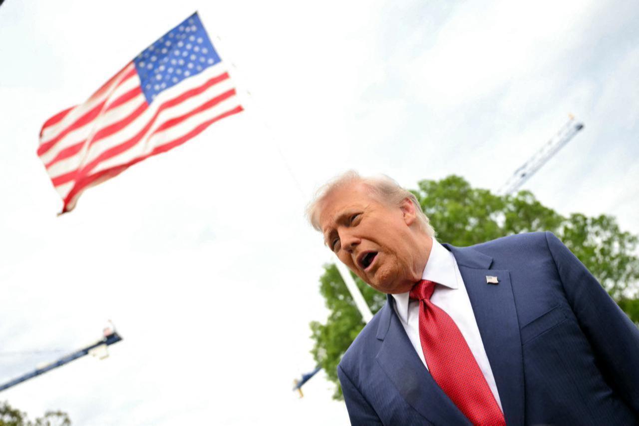 US President Donald Trump speaks to journalists as he makes his way to board Marine One before departing from the South Lawn of the White House in Washington, DC, May 8, 2026. (AFP Photo)