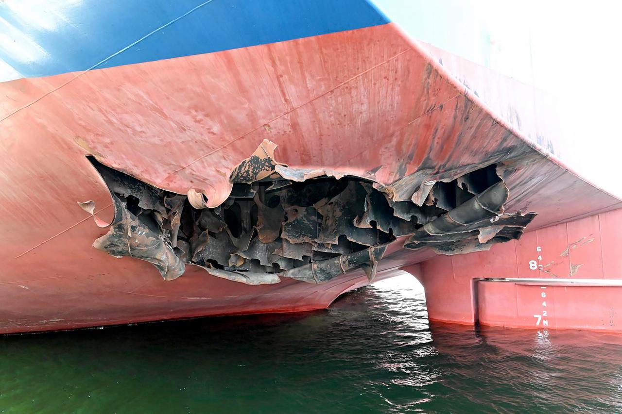 This undated handout photograph released by South Korea's Foreign Ministry on May 10, 2026, shows a damaged part of the South Korean cargo ship HMM Namu docked at a port in Dubai. (Photo by Handout/South Korean Foreign Ministry/AFP)