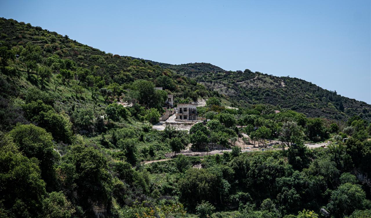 A distant view shows redevelopment activity in Trozena, an abandoned village between Limassol and Paphos in Greek Cyprus. (Photo via Politis)
