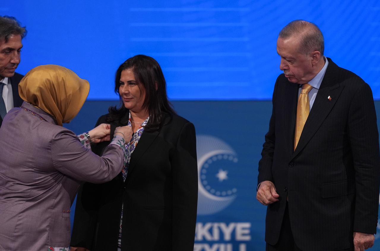 Turkish President and Leader of the Justice and Development (AK) Party Recep Tayyip Erdogan greets the Mayor of Aydin Ozlem Cercioglu who joins the AK Party during the AK Party's 24th Foundation Anniversary Event at the AK Party Congress Center in Ankara, Türkiye on August 14, 2025. (AA Photo)