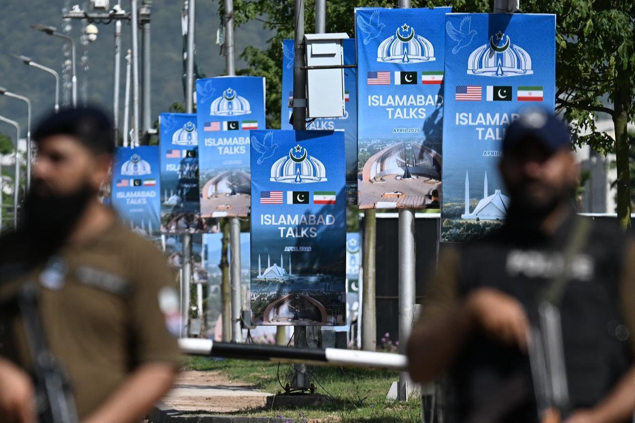 Security personnel stand guard at a security checkpost along a road temporarily closed near the Serena Hotel at the Red Zone area in Islamabad, April 20, 2026. (AFP Photo)