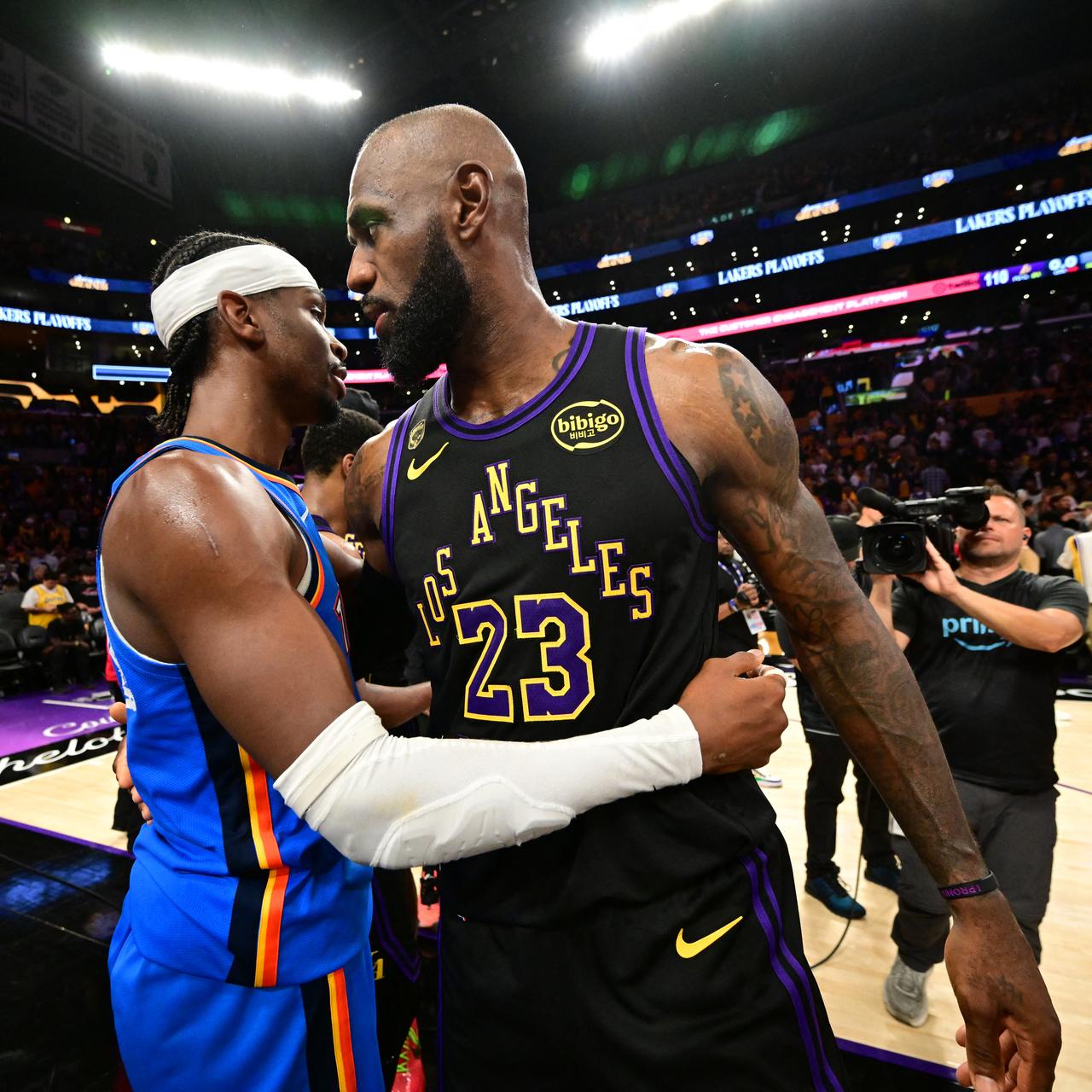 LeBron James #23 of the Los Angeles Lakers and Shai Gilgeous-Alexander #2 of the Oklahoma City Thunder hug after the game during Round Two Game Four of the 2026 NBA Playoffs on May 11, 2026 at Crypto.Com Arena in Los Angeles, California (AFP Photo)