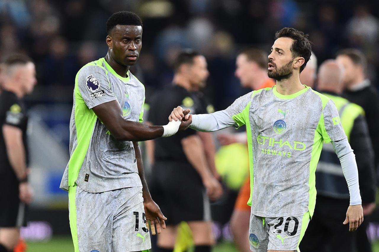 Manchester City's English defender #15 Marc Guehi (L) and Manchester City's Portuguese midfielder #20 Bernardo Silva react at the end of the English Premier League football match between Everton and Manchester City at Hill Dickinson Stadium in Liverpool on May 4, 2026. (AFP Photo)