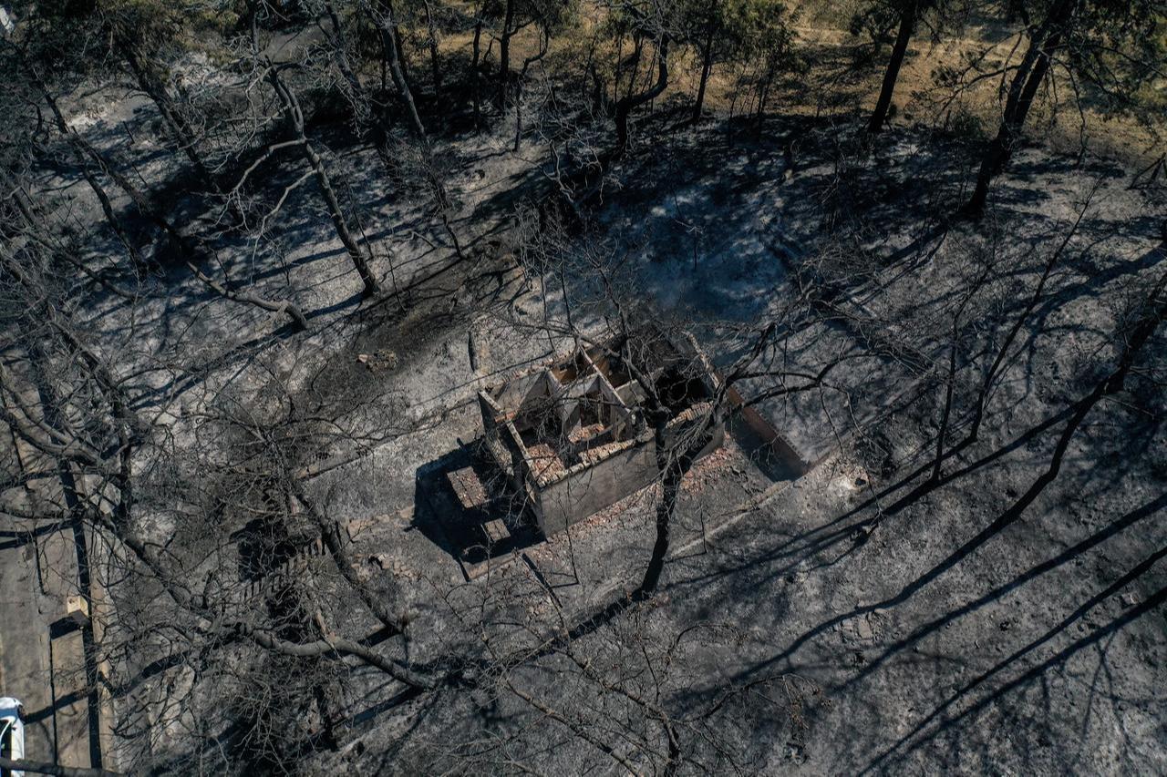An aerial view of Kepez district after the wildfire that erupted and spread across, as firefighting efforts continue in Canakkale, Turkiye, August 12, 2025. (AA Photo)