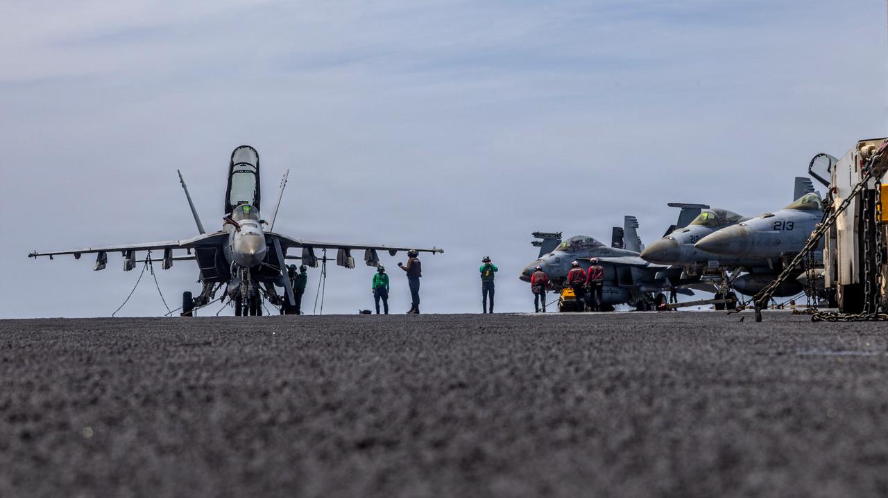 This US Navy handout photo released on May 4, 2026, by US Central Command Public Affairs shows US sailors conducting maintenance on the flight deck of the Nimitz-class aircraft carrier USS Abraham Lincoln (CVN 72) at sea on April 15, 2026. (US Navy Handout/AFP Photo)