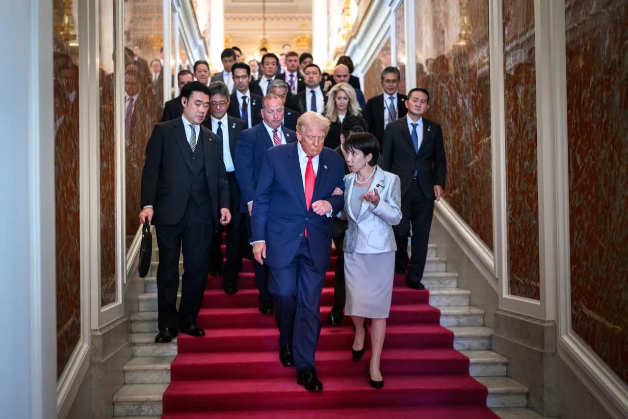 This photograph captures President Donald Trump walking arm-in-arm with Japan's Minister of State for Abduction Issues, Sanae Takaichi in October 2025. (White House Photo)