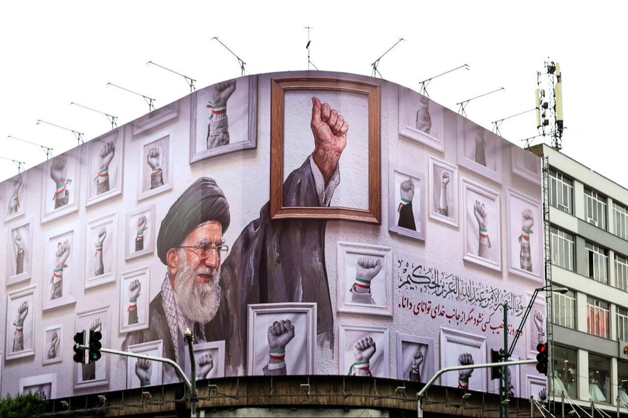 A huge billboard carrying the image of the late Iranian supreme leader Ali Khamenei, killed in February 2026 in a military attack by the US and Israel on Iran, wraps the front of a building in Tehran, Iran, May 5, 2026. (AFP Photo)
