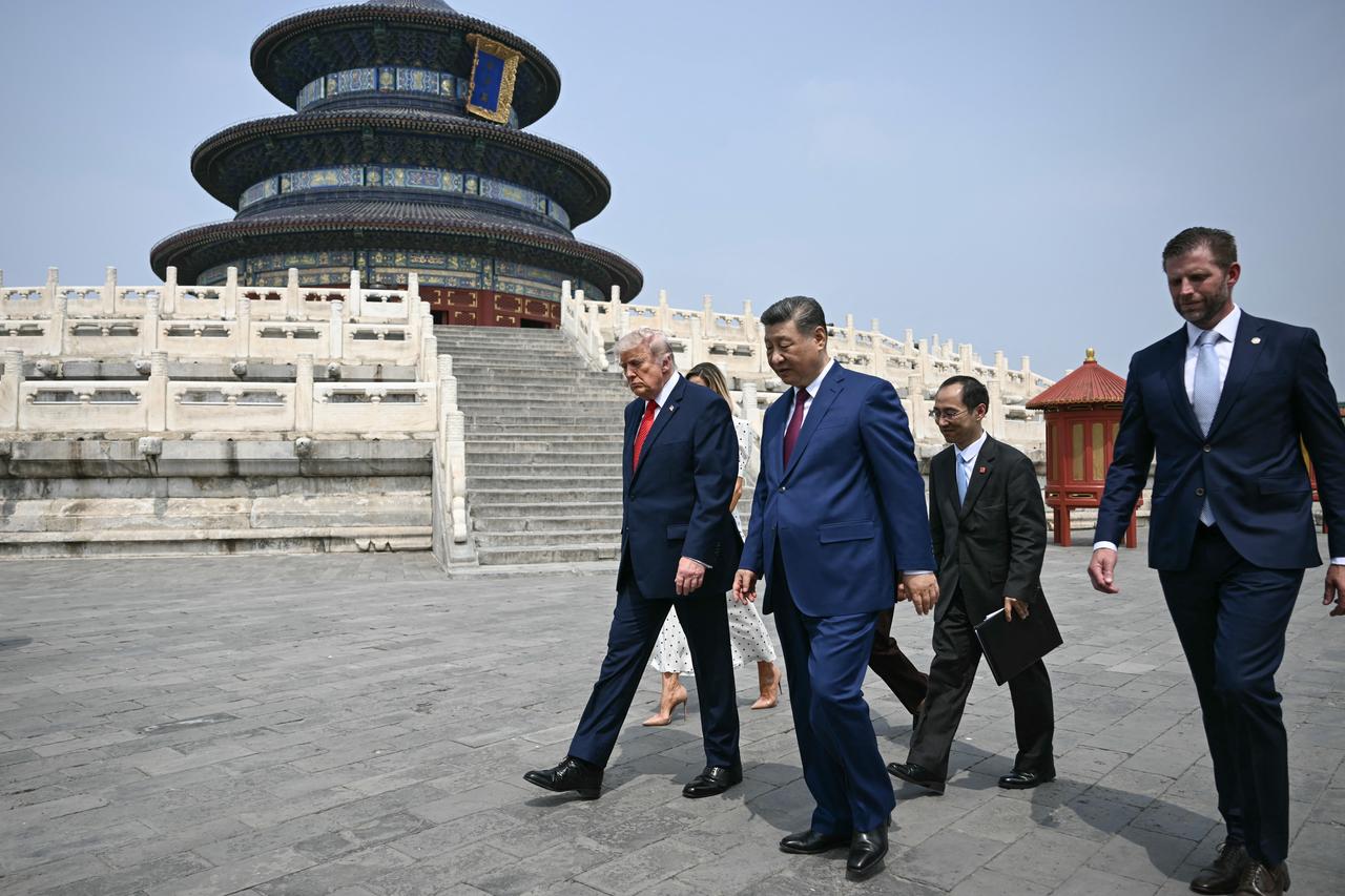 China's President Xi Jinping (C), US President Donald Trump (L) and Eric Trump (R) visit the Temple of Heaven in Beijing, China, May 14, 2026. (AFP Photo)
