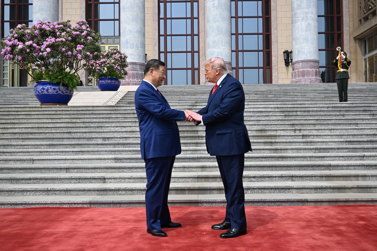 US President Donald Trump (R) shakes hands with China's President Xi Jinping at the Great Hall of the People in Beijing, China, May 14, 2026. (AFP Photo)