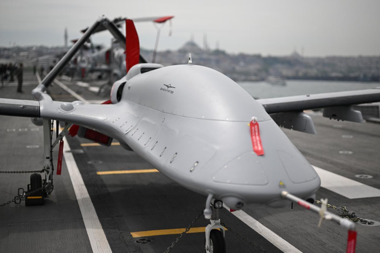 The Bayraktar TB3 unmanned aerial vehicle is seen as people visit the TCG Anadolu at the Sarayburnu Port during the SAHA 2026 International Defense, Aerospace and Space Industry Exhibition in Istanbul, May 8, 2026. (AA Photo)