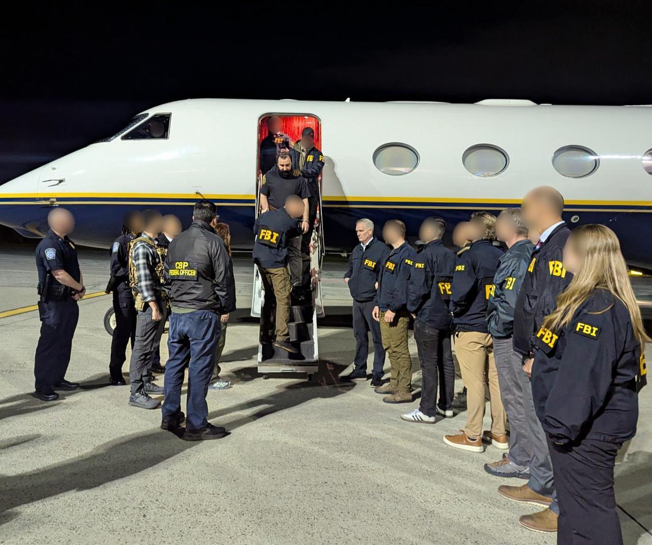 FBI agents escorting Mohammad Baqer Saad Dawood Al-Saadi, a senior member of Kata’ib Hezbollah, on May 15, 2026. (Photo via X/@NewYorkFBI)
