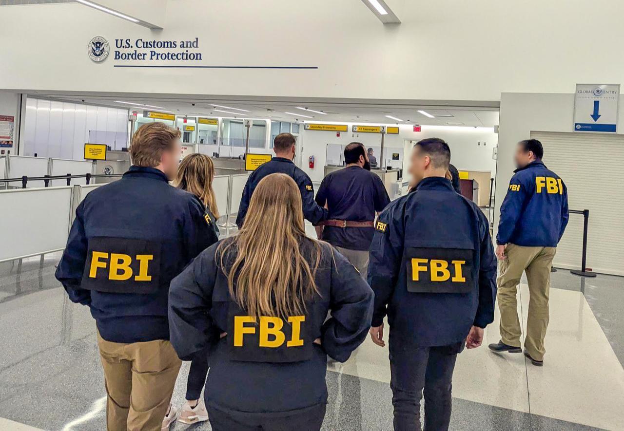 FBI agents escorting Mohammad Baqer Saad Dawood Al-Saadi, a senior member of Kata’ib Hezbollah, on May 15, 2026. (Photo via X/@NewYorkFBI)