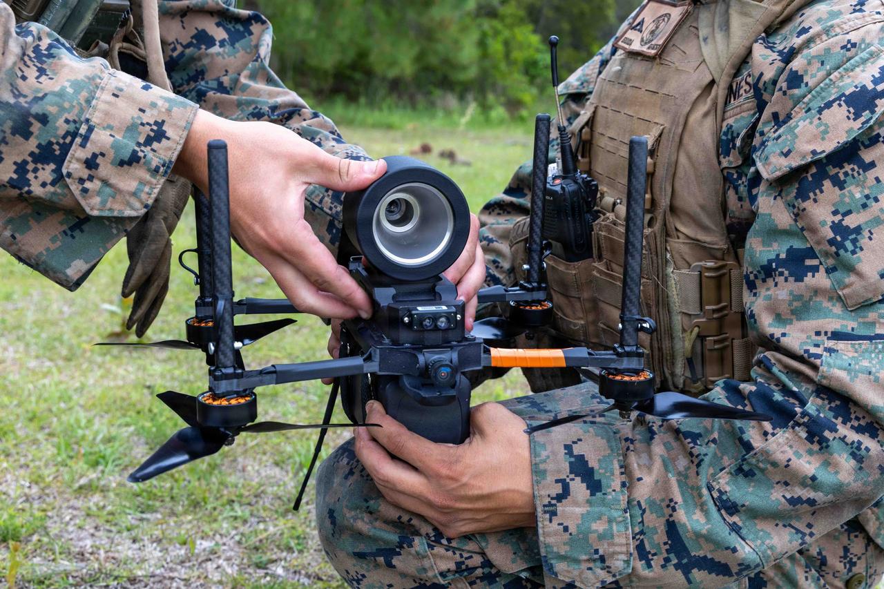 U.S. Marines attach a simulated warhead to a Neros Archer first-person drone during a FPV drone course on Marine Corps Base Camp Lejeune, North Carolina, April 29, 2026. (Photo via U.S. Marine Corps)