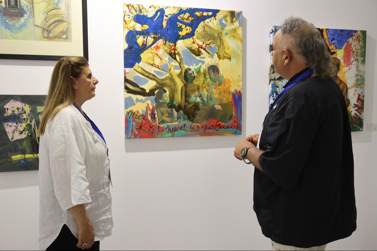 Artists examine artworks at the “Meeting of Cultures” exhibition during the 9th Art Thessaloniki Contemporary Art Fair in Thessaloniki, Greece, May 15, 2026. (AA Photo)