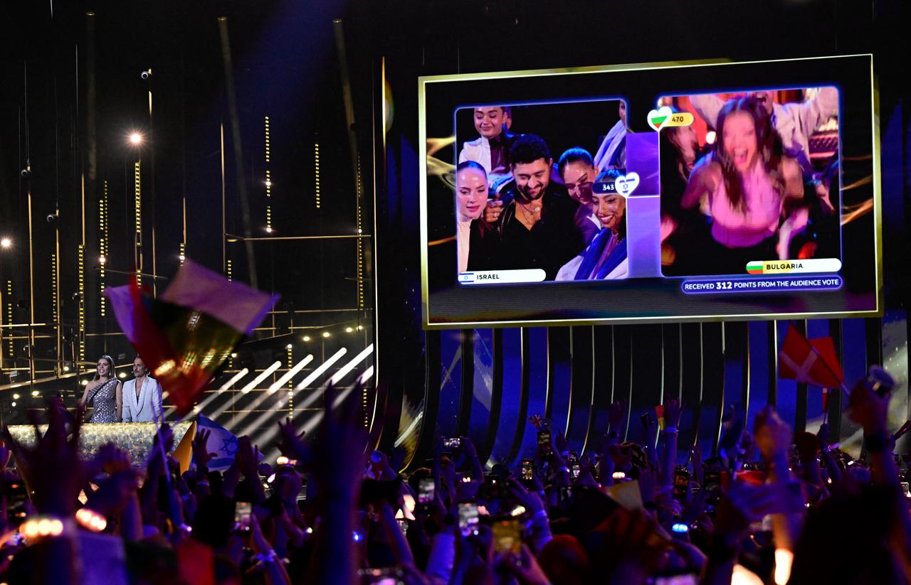 A screen shows Darina Nikolaeva Yotova, aka Dara and representing Bulgaria with the song 'Bangaranga',(R) celebrating the final vote during the final of the Eurovision Song Contest 2026 (ESC) at Wiener Stadthalle in Vienna, Austria, May 16, 2026. (AFP Photo)