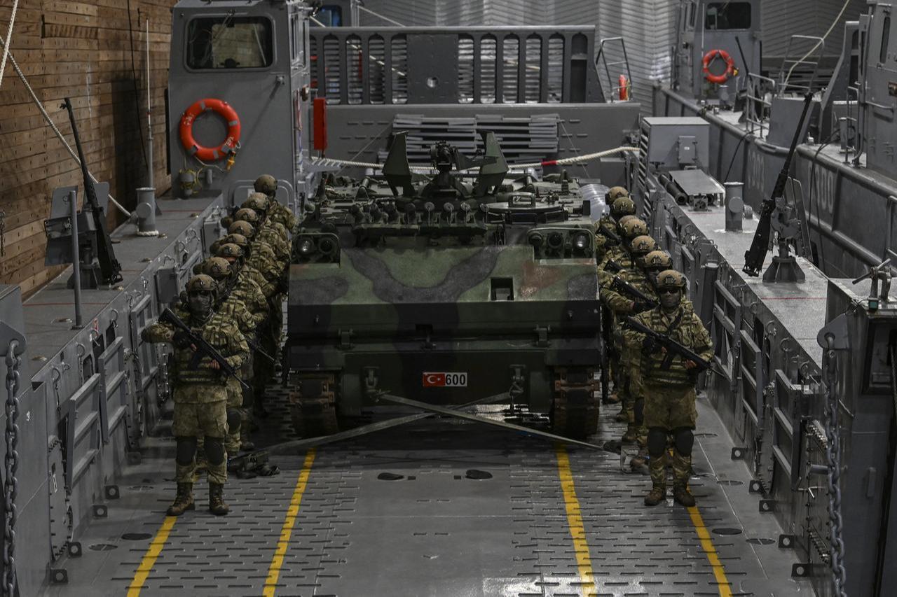 Turkish soldiers stand next to an ACV-15 tracked IFV at the TCG Anadolu anchored off the coast of Atakoy in Istanbul, Türkiye, May 6, 2026. (AA Photo)