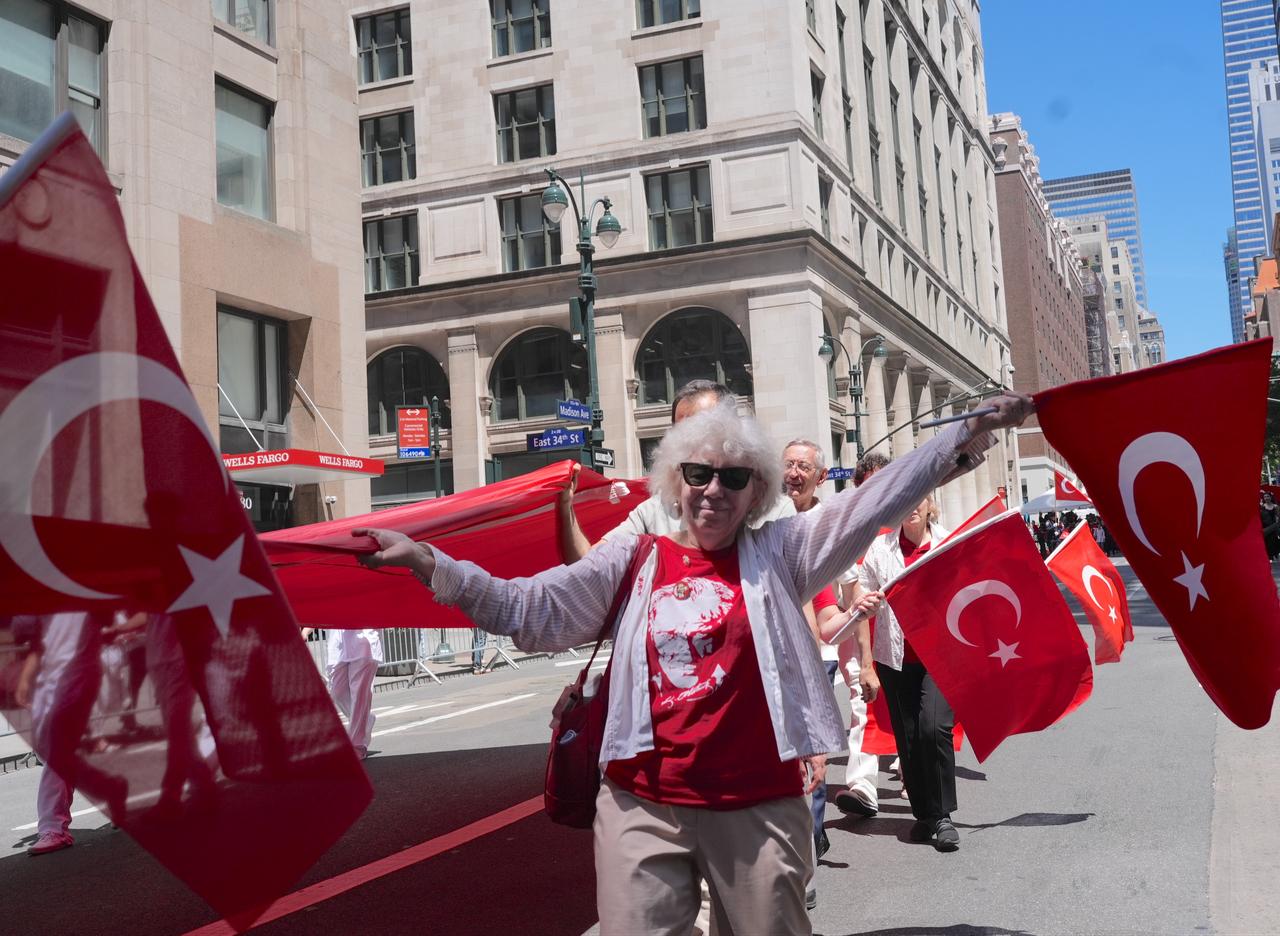 Participants march down the street carrying flags during the 43rd annual Turkish Day Parade and Festival in New York, United States, May 16, 2026. (AA Photo)