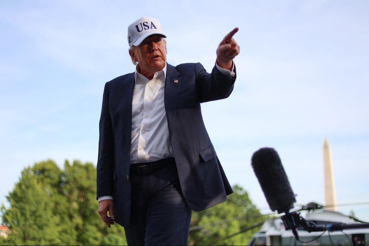 US President Donald Trump gestures as he speaks to reporters after arriving on the South Lawn of the White House in Washington, DC, May 15, 2026. (AFP Photo)