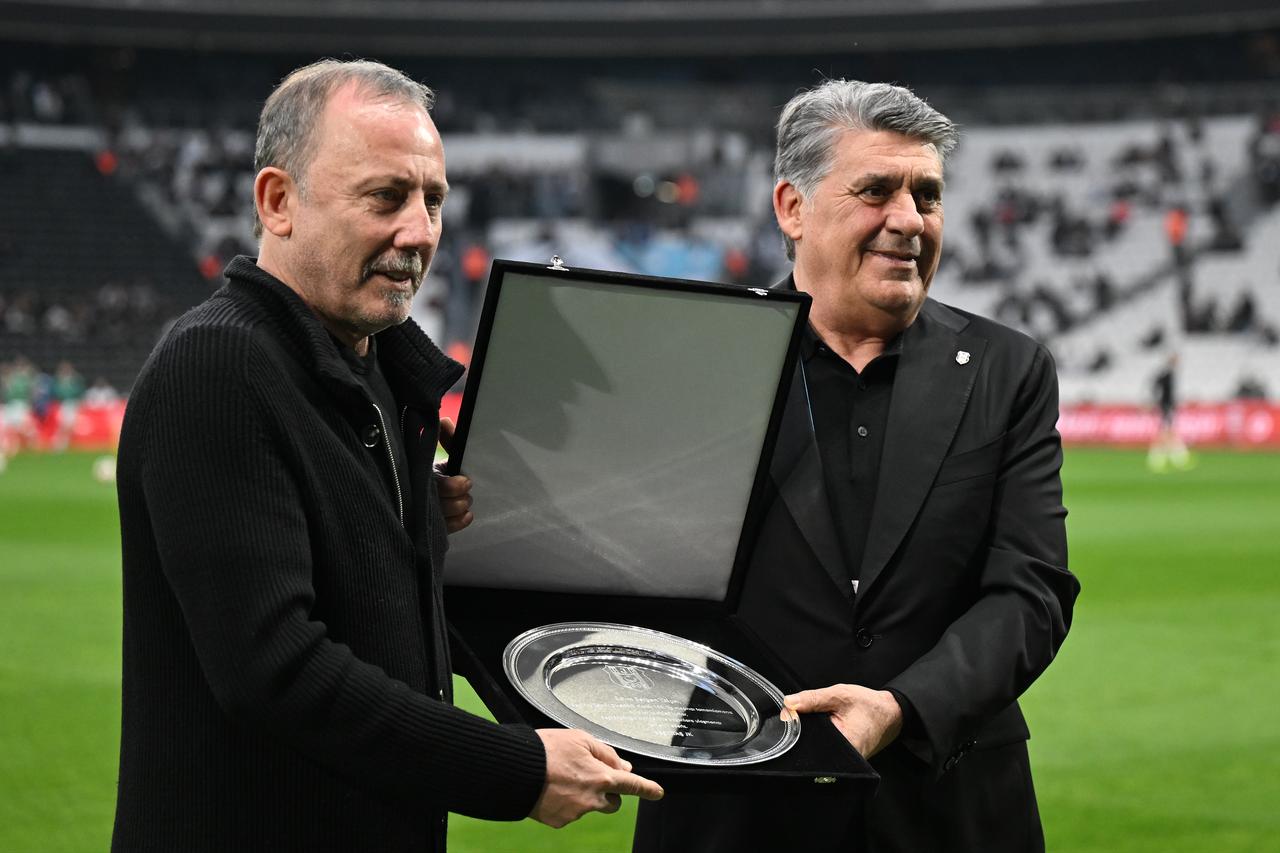 Besiktas head coach Sergen Yalcin (L) receives a plaque from club president Serdal Adali (R) ahead of the Turkish Cup semifinal match against TUMOSAN Konyaspor at Tupras Stadium in Istanbul, Türkiye, May 5, 2026. (AA Photo)