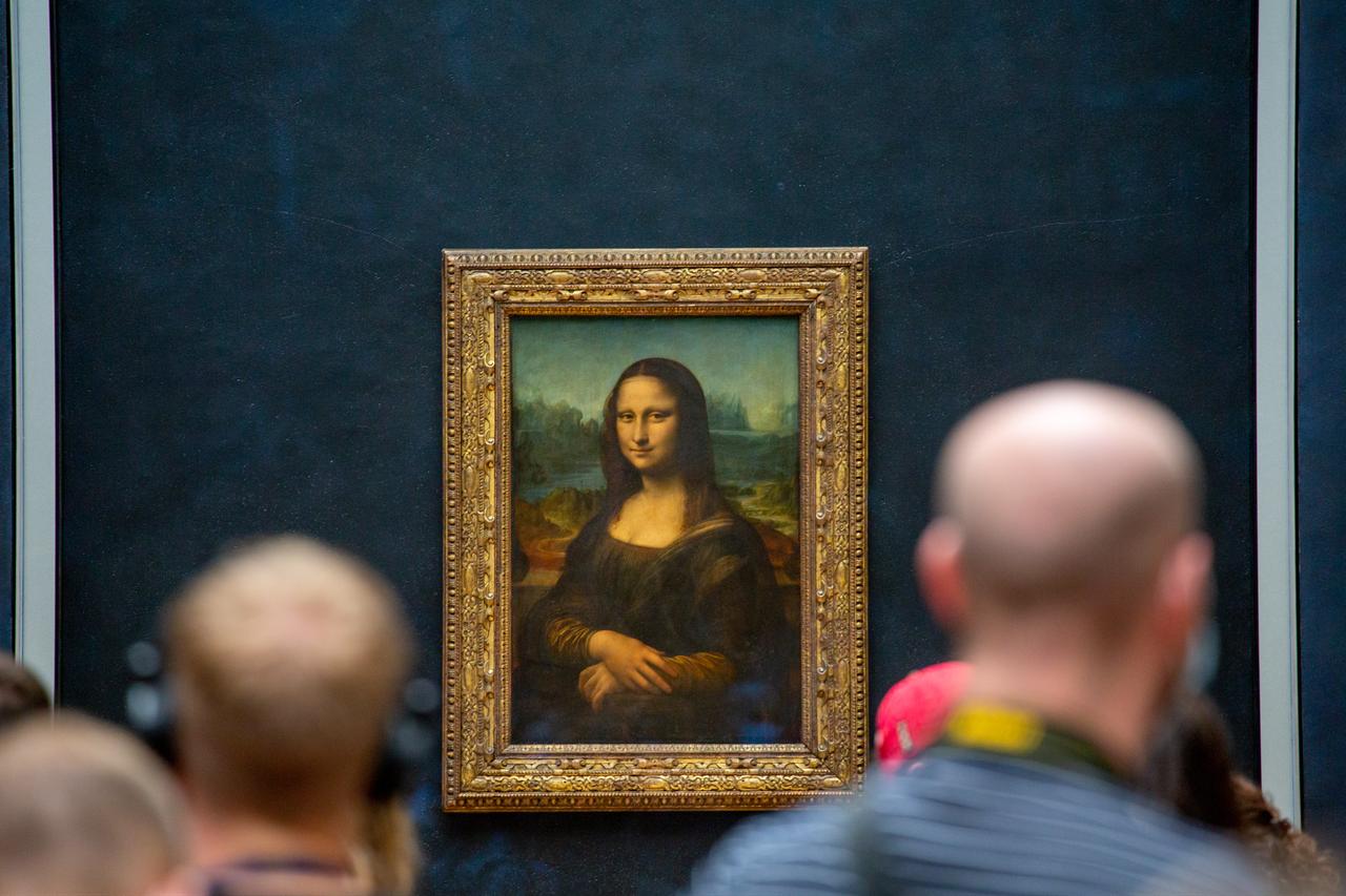 Visitors view Leonardo da Vinci’s Mona Lisa at the Louvre Museum in Paris, France (Adobe Stock Photo)