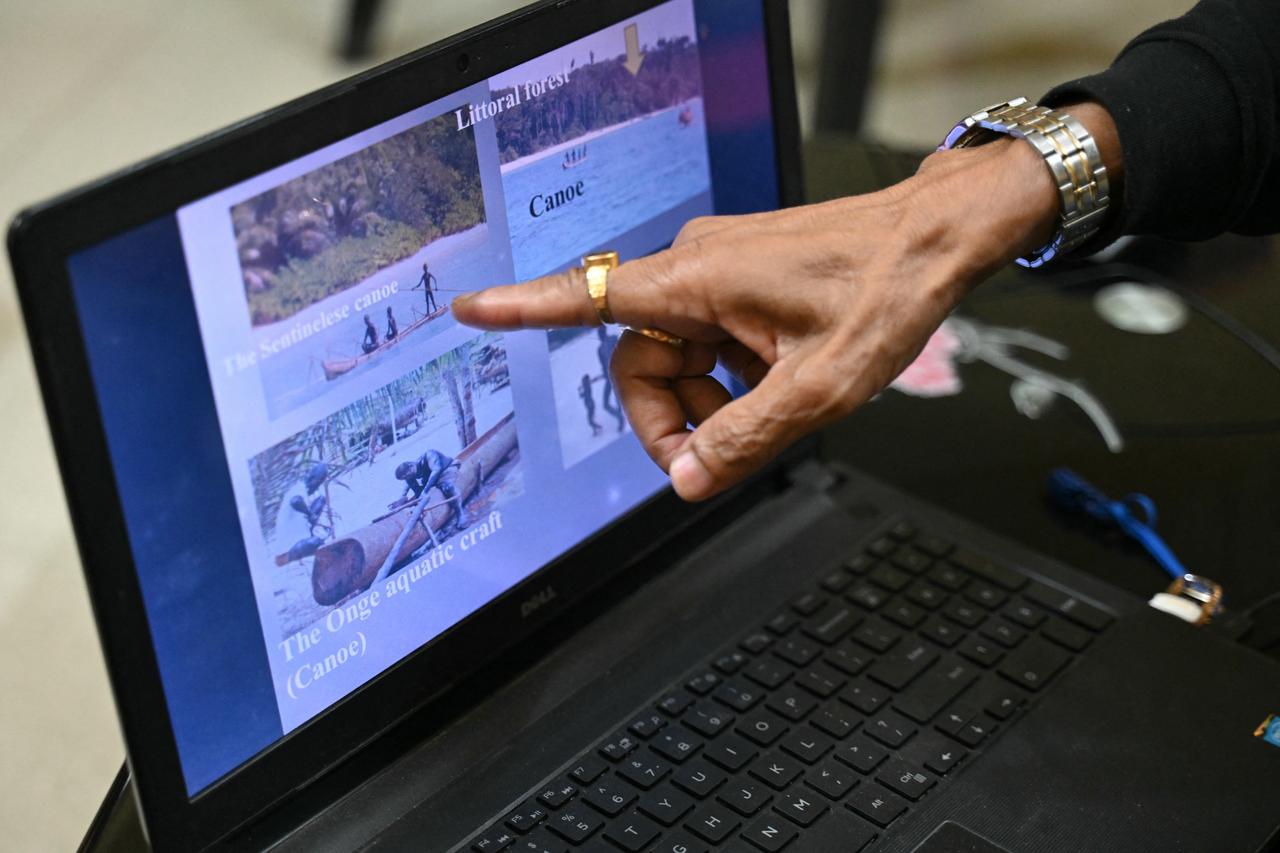 This photograph shows Anthropological Survey of India's former deputy director Anstice Justin showing pictures of tribes during an interview with in Andaman and Nicobar Islands, India on March 31, 2026 (AFP Photo)