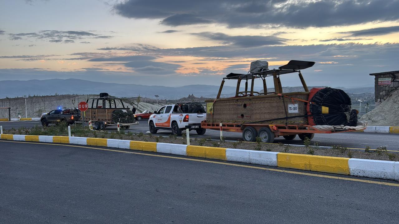 Vehicles towing hot air balloon baskets leave launch areas in Cappadocia after authorities cancelled flights due to unfavorable weather conditions in Nevsehir, Türkiye. (AA Photo)