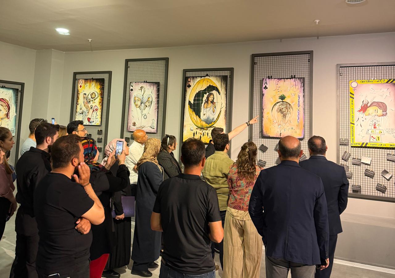 Visitors view works from Vahap Aydogan’s “Sukut” exhibition at Sanliurfa Archaeology Museum during Museums Week. (Photo via Vahap Aydogan)