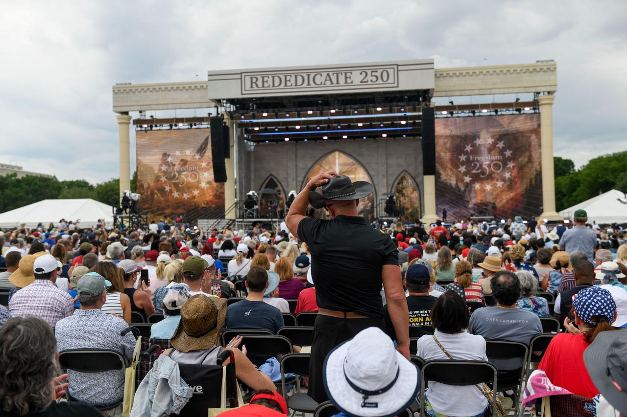 Attendees celebrate during "Rededicate 250: A National Jubilee of Prayer, Praise and Thanksgiving" on the National Mall in Washington, DC, on May 17, 2026. (AFP Photos)