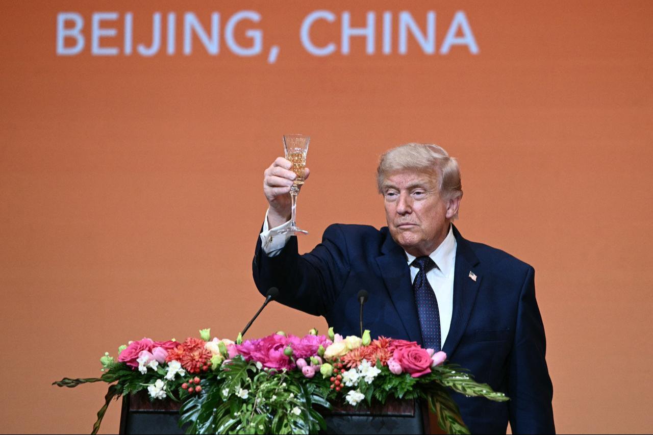 US President Donald Trump makes a toast as he attends a state banquet with China's President Xi Jinping at the Great Hall of the People in Beijing, China, May 14, 2026. (AFP Photo)
