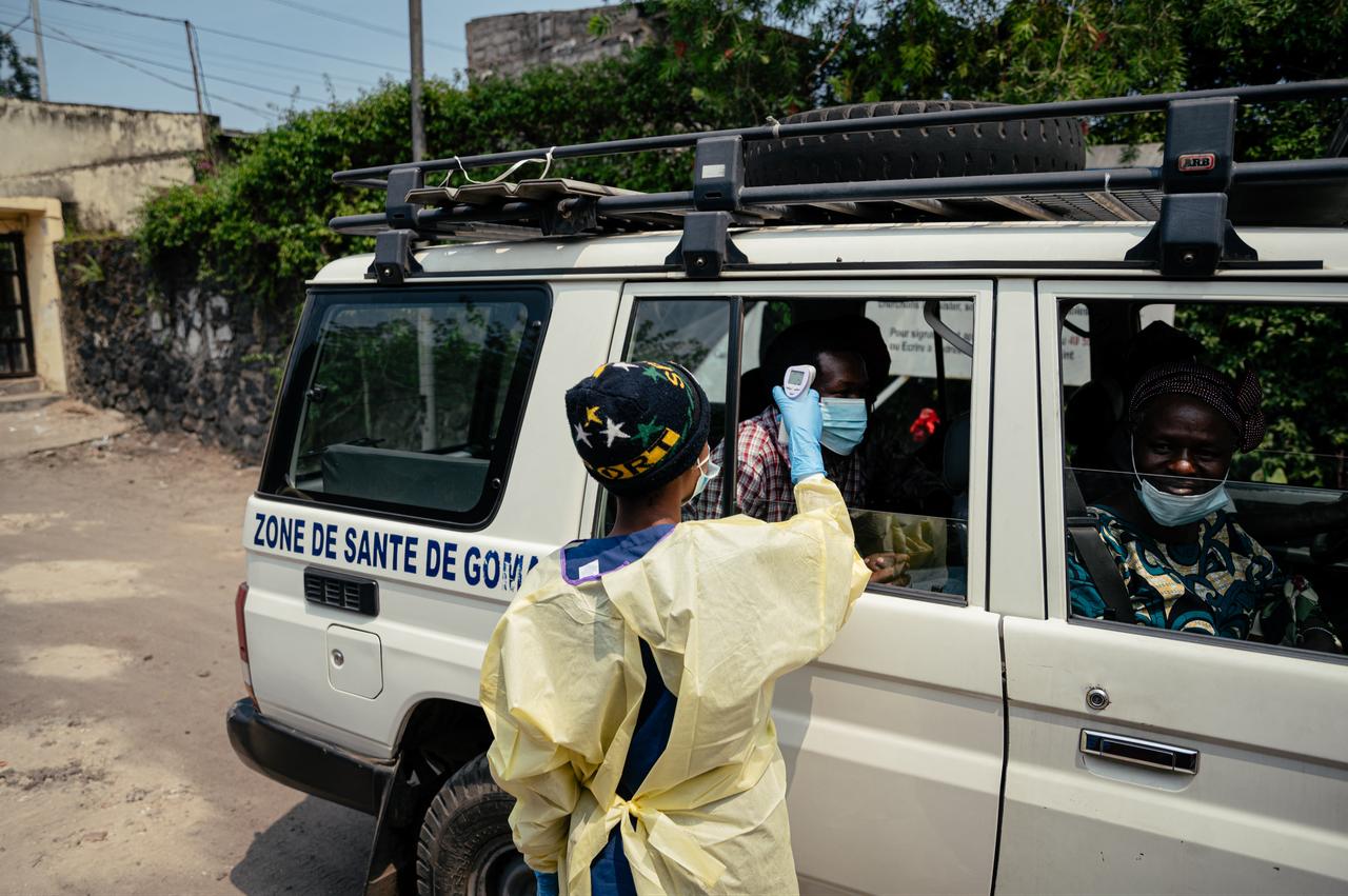 A visitor has their temperature checked by a health worker using a thermoflash before entering Kyeshero Hospital at a checkpoint in Goma on May 18, 2026. (AFP Photo)
