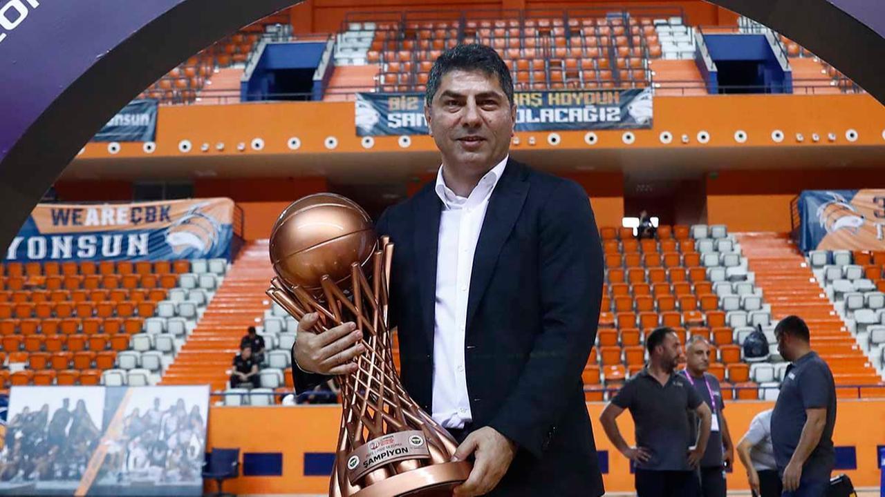 Hakan Safi, chairman of Safiport, the main sponsor of the Fenerbahce Safiport women’s basketball team, holds the club’s championship trophy at an indoor arena in Türkiye, May 15, 2022. (Photo via fenerbahce.org)