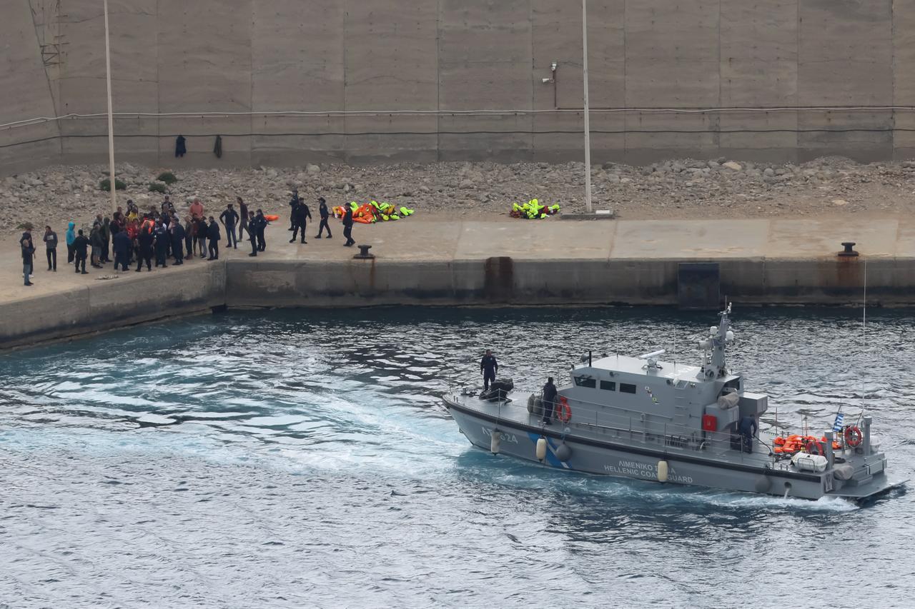 Activists from the Global Sumud Flotilla stand at the port of Atherinolakkos on the island of Crete after disembarking from a Greek Coast Guard vessel, following their interception by the Israeli Navy in international waters, May 1, 2026. (AFP Photo)