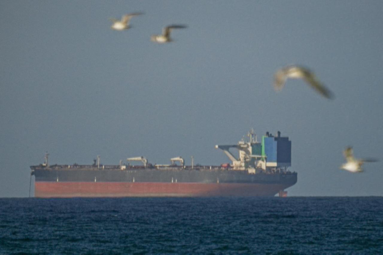 A ship waits to pass through the Strait of Hormuz following the two-week temporary ceasefire between the US and Iran, which is conditional on the opening of the strait, in Oman on April 8, 2026. (AA Photo)