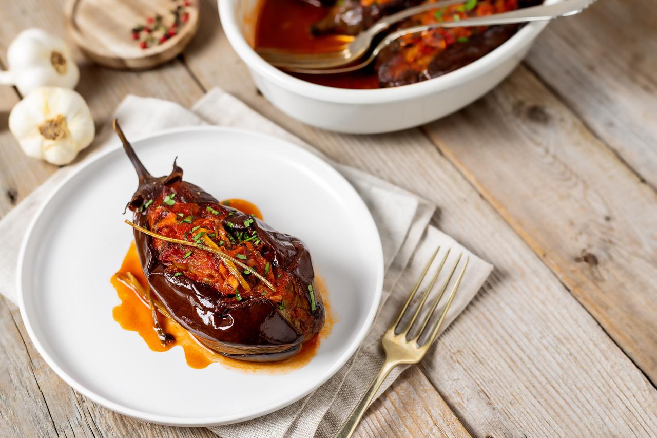Imam bayildi served glossy with olive oil, capturing the rich, slow-cooked texture at the center of the dish, accessed on May 2, 2026. (Adobe Stock Photo)