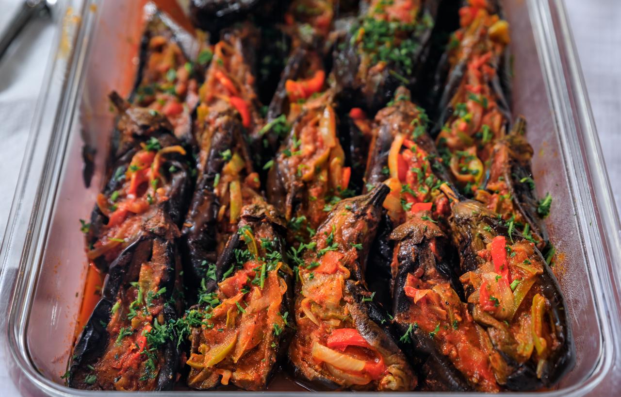 A tray of imam bayildi prepared in batches, ready to be served after slow cooking, accessed on May 2, 2026. (Adobe Stock Photo)