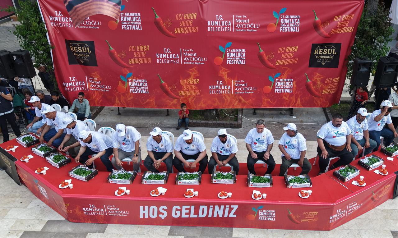 Participants compete in a hot pepper eating contest during the 27th Kumluca Agriculture and Greenhouse Festival in Antalya, Türkiye, May 1, 2026. (AA Photo)