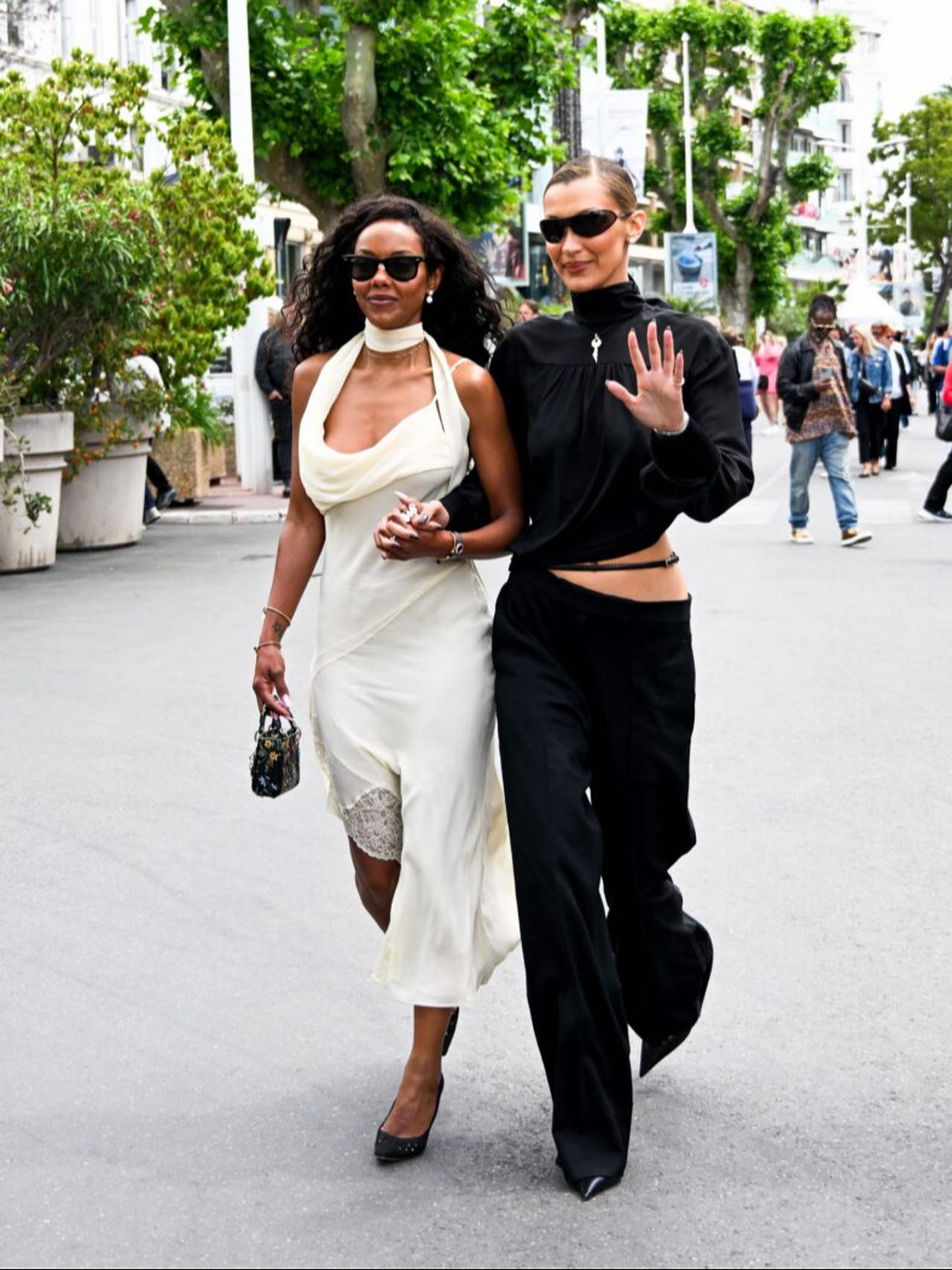 Bella Hadid walks hand in hand with Fanny Bourdette-Donon in Cannes, France. (Photo via Just Jared)