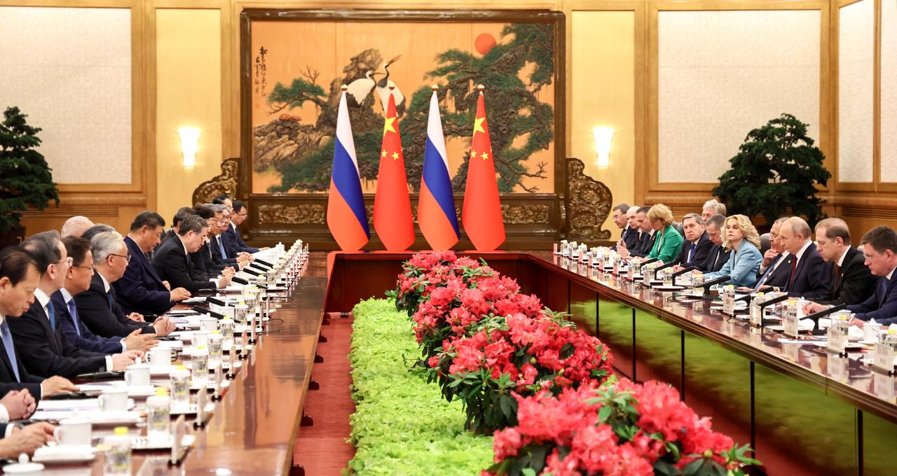 Russia's President Vladimir Putin (3rd R) and China's President Xi Jinping (center L) take part in a meeting in Beijing, May 20, 2026. (AFP Photo)