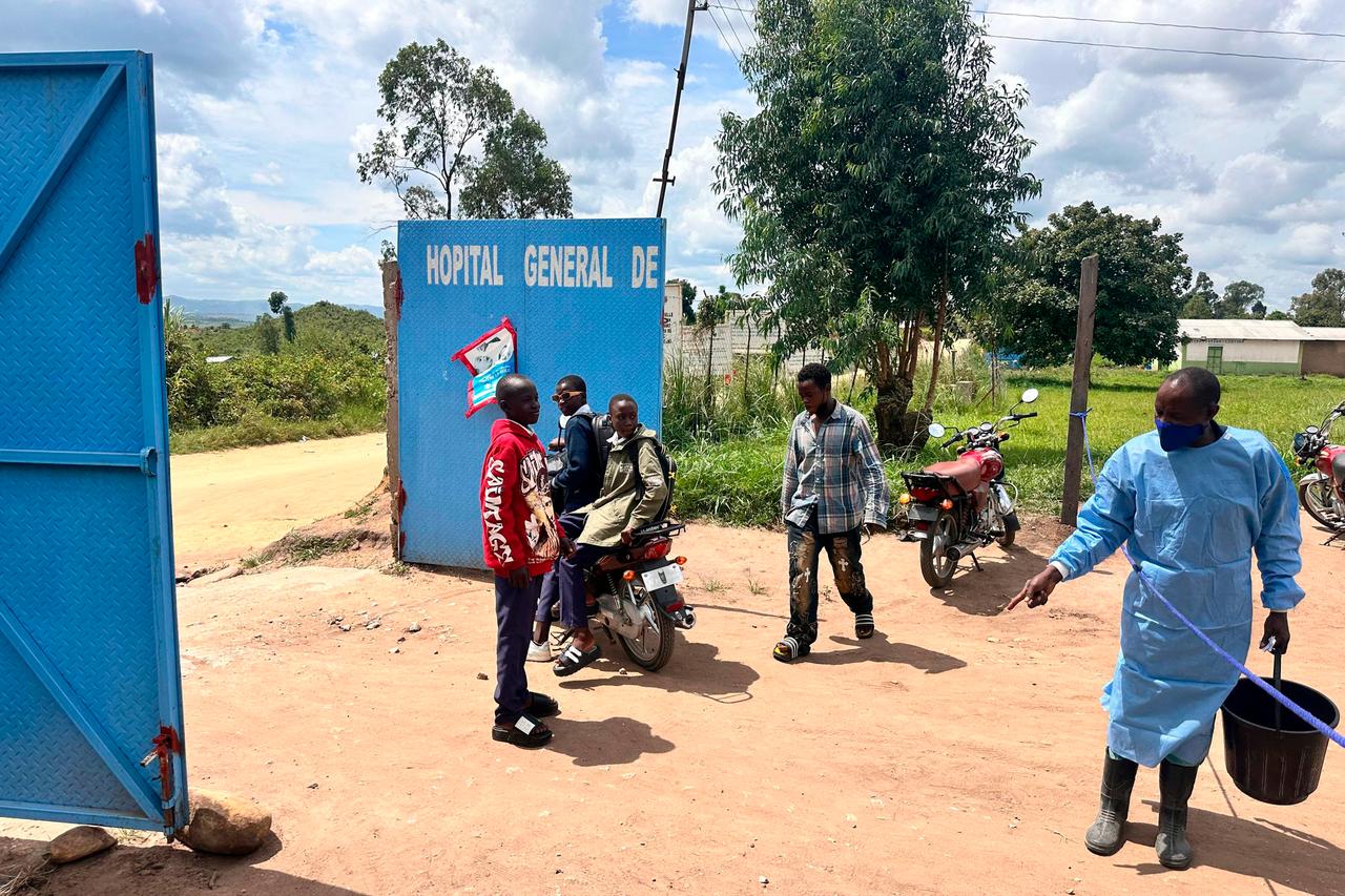 A healthcare worker in personal protective equipment (PPE) is seen at the entrance of a hospital in Rwampara, DR Congo, May 19, 2026. (AFP Photo)