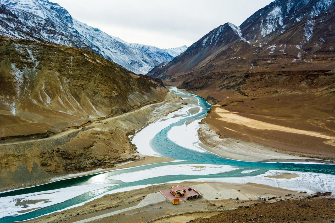 Confluence of the Indus and Zanskar Rivers which are almost frozen due to extreme cold during winter and famous for chadar trek at Leh, Ladakh, India. (Adobe Stock photo)