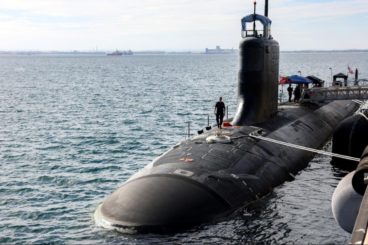 US Navy officers stand guard aboard the Virginia-class fast-attack submarine USS Minnesota after the vessel docked at HMAS Stirling in Rockingham, Western Australia, February 26, 2025. (AFP Photo)