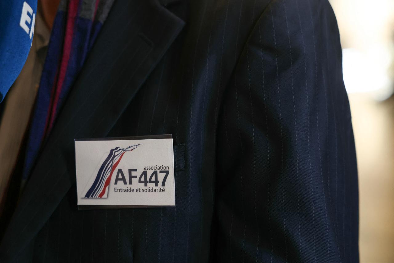 This photograph shows a badge from the AF447 association on lapel of Philippe Linguet, brother of a victim of the crash and vice president of the association, at the Court of Appeal for the appeal trial of Airbus and Air France for "involuntary manslaughter" in the crash of the Rio-Paris Air France flight A330 on June 1, 2009 which killed 228 people, in Paris, France, September 29, 2025. (AFP Photo)