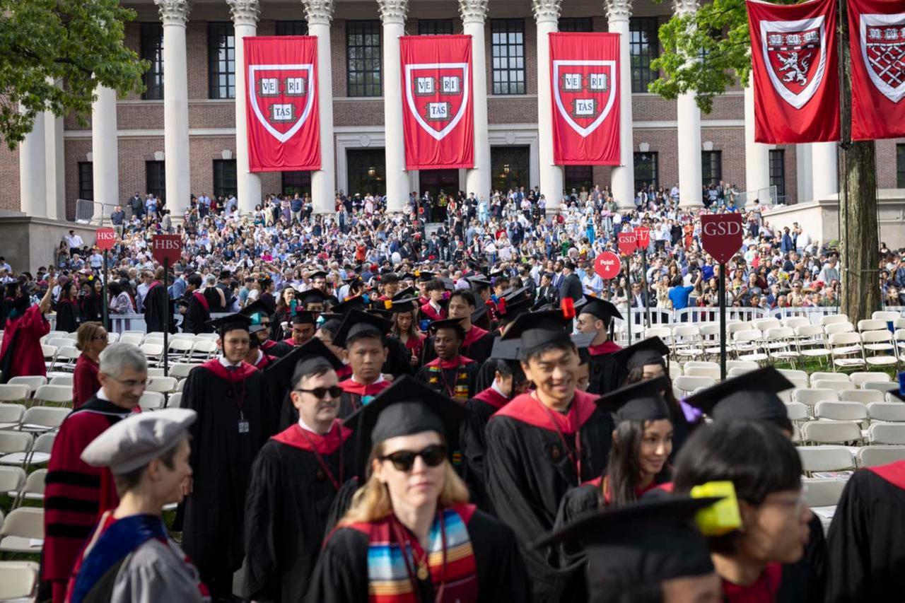 Harvard graduates processing into Tercentenary theatre during a commencement ceremony. (Photo via Harvard)