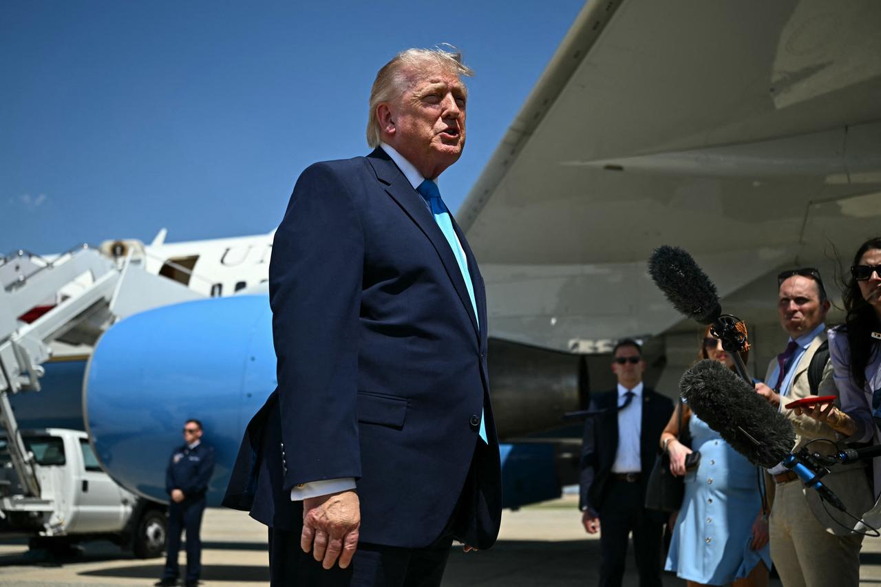 US President Donald Trump speaks to reporters after stepping off Air Force One at Joint Base Andrews, Maryland on May 20, 2026, as he returns to Washington, DC. (AFP Photo)