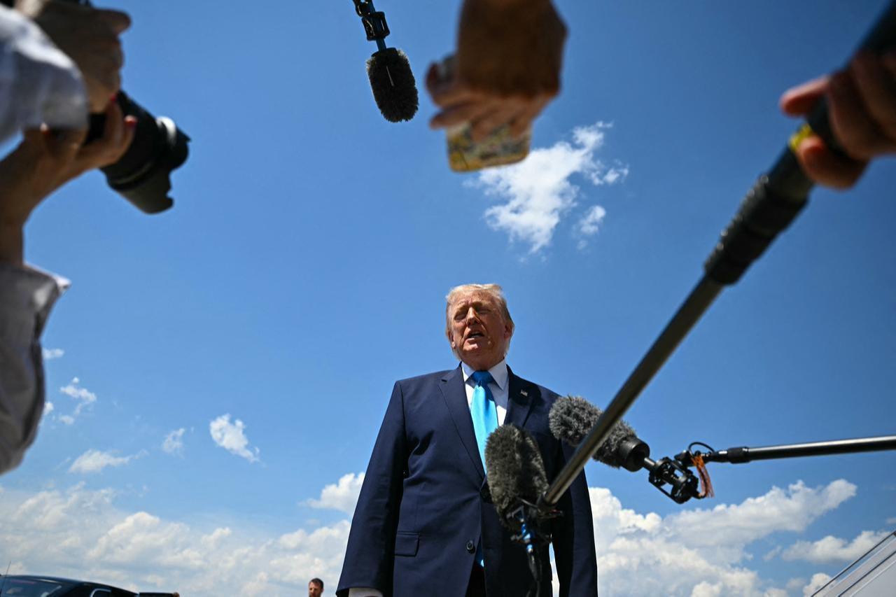 US President Donald Trump speaks to reporters after stepping off Air Force One at Joint Base Andrews, Maryland on May 20, 2026, as he returns to Washington, DC. (AFP Photo)