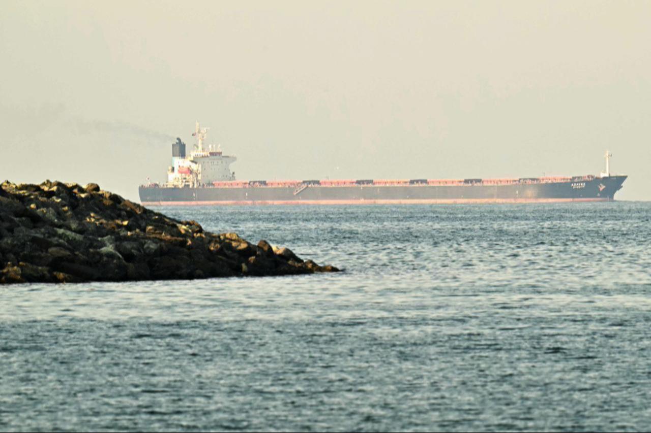 A cargo ship is pictured off the coast of the city of Fujairah, in the Strait of Hormuz, in the northern Emirate, February 25, 2026. (AFP Photo)