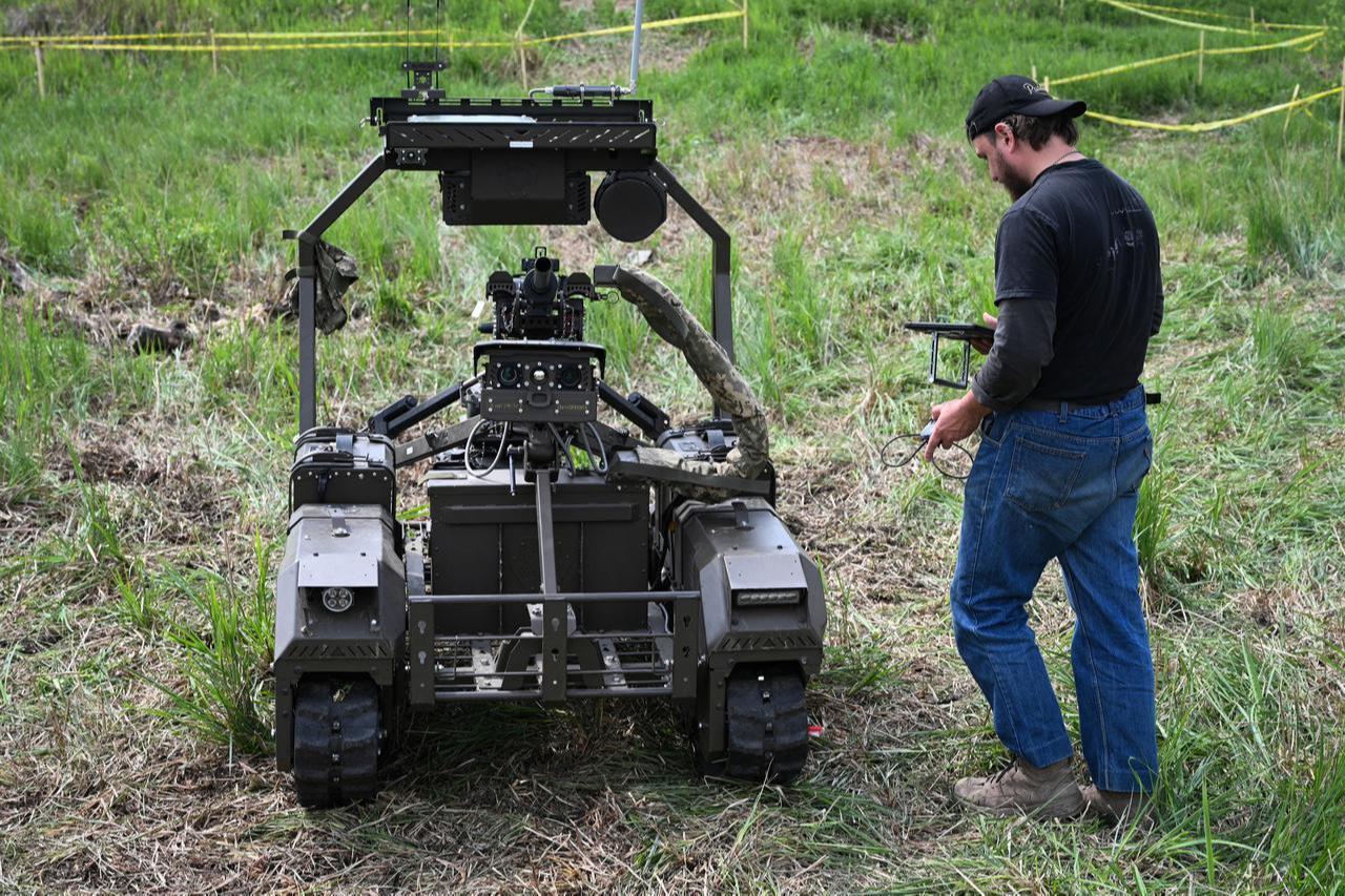 A man pilots an unmanned ground vehicle (UGV) during the “Wild Drones” racing competition, designed to simulate battlefield conditions, in Truskavets, Lviv region, on May 20, 2026. (AFP Photo)